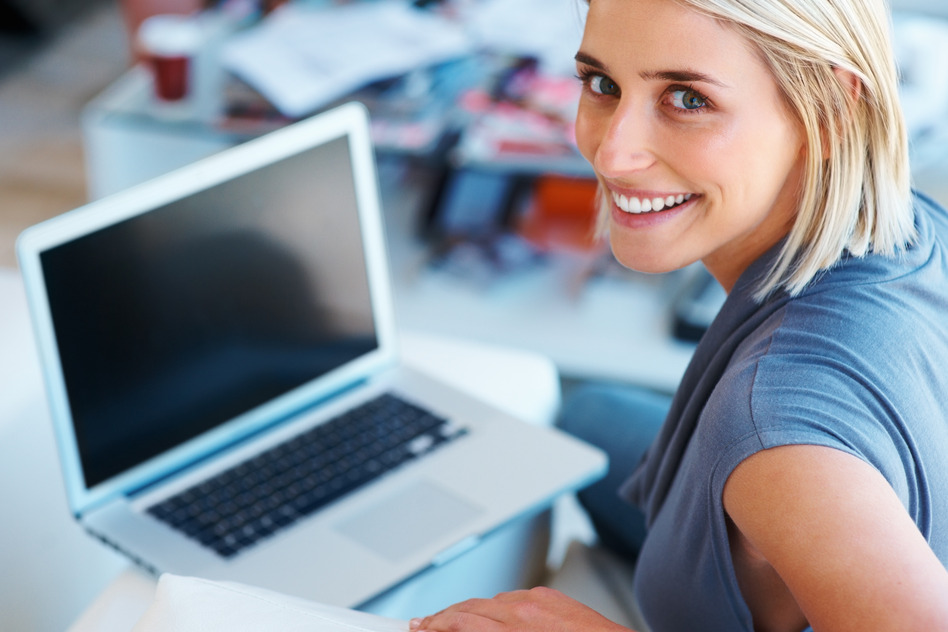 happy-woman-working-on-laptop